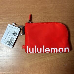 Lululemon Clippable Card Pouch. SOLD OUT SLRO/WHT  (Solar Orange/White). NWT